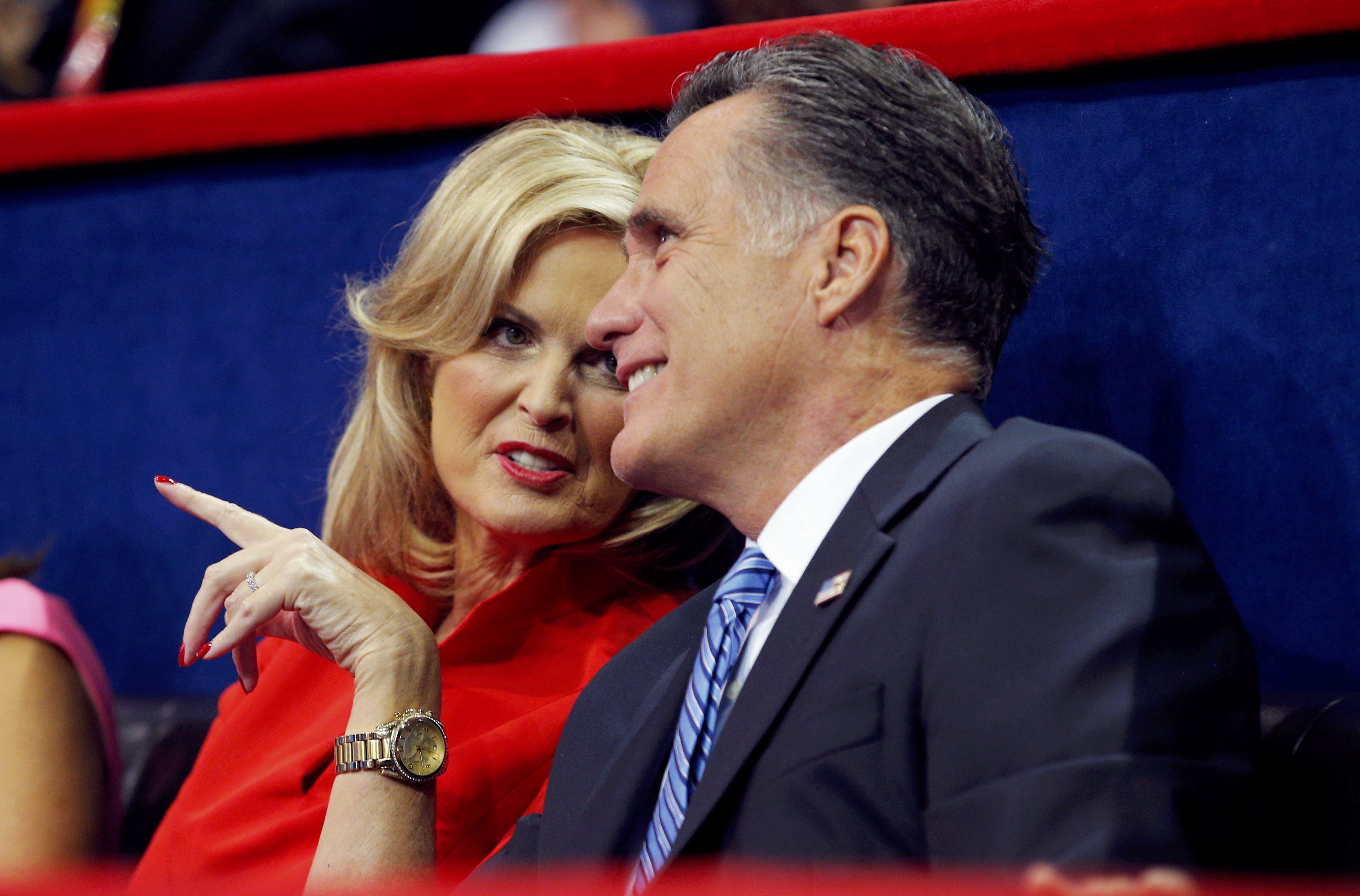 Republican presidential nominee Mitt Romney talks with his wife Ann as they listen to New Jersey Governor Chris Christie deliver the keynote address during the second session of the 2012 Republican National Convention in Tampa