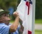 Marion County maintenance worker Vic Pollock adjusts the Confederate flag on the flag pole outside the McPherson Governmental Complex in Ocala, Fla., on Tuesday, July 7, 2015. The Marion County Commission voted Tuesday to put the flag back up after taking it down recently. (Alan Youngblood/Ocala Star-Banner via AP) MANDATORY CREDIT MAGS OUT