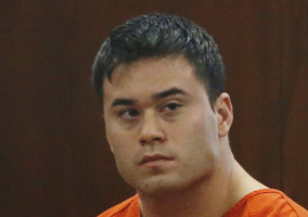 Daniel Holtzclaw, an Oklahoma City police officer accused of sexually assaulting women he encountered while on patrol in neighborhoods near the state Capitol, is pictured in a courtroom during a hearing on whether to cut his bond from $5 million to $139,000, in Oklahoma City, Wednesday, Sept. 3, 2014. (AP Photo/Sue Ogrocki)